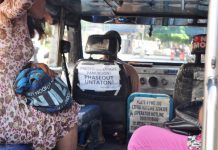 SILENT PROTEST. A poster at the back of this jeepney driver’s seat expresses his sentiment on the planned scrapping of old jeepneys and the incessant fuel price hikes. PN PHOTO