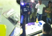 Suspected drug pusher Jose Benuelle Delgado sits handcuffed. Police caught him selling drugs to a poseur-buyer in Barangay Andagao, Kalibo, Aklan on Sept. 24. BOY RYAN ZABAL/AKEAN FORUM