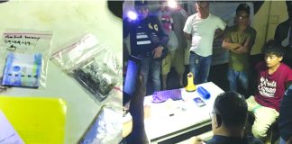 Suspected drug pusher Jose Benuelle Delgado sits handcuffed. Police caught him selling drugs to a poseur-buyer in Barangay Andagao, Kalibo, Aklan on Sept. 24. BOY RYAN ZABAL/AKEAN FORUM