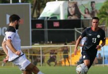 The Philippines’ Justin Baas (left) attempts to chase a Guam player kicking the ball during their 2022 World Cup/2023 Asian Cup qualification on Tuesday at the Guam National Football Stadium. AFC PHOTO