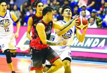 Kiefer Ravena of NLEX Road Warriors is hacked by Phoenix Fuel Masters’ Ryan Roose Garcia. PBA PHOTO