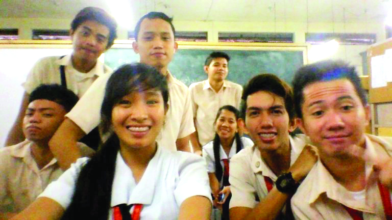 MJ Felongco and her classmates during her college years at the University of San Agustin.