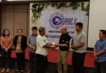 Families of victims in Iloilo Strait mishap receive financial aid Marcelino Java from Iloilo City receives two checks from Civil Defense Regional Director Jose Roberto Nuñez (3rd from right) as financial assistance on Thursday. Java lost his wife Adora and grandson Jhairus James Alejado during the Aug. 3 sea tragedy off Iloilo Strait. PERLA G. LENA/PNA