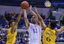 Ateneo Blue Eagles’ Matt Nieto tries to get his shot up against the defense of University of Santo Tomas Tigers’ Rhenz Abando. UAAP PHOTO