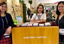 NegOcc introduces new tourism sites Negros Occidental supervising tourism operations officer Cristine Mansinares (right) with the Department of Tourism-Western Visayas staff during the 30th Philippine Travel Mart at the SMX Convention Center at Mall of Asia Complex in Pasay City. PNA