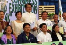 Agriculture Assistant Secretary Rene Famoso (seated, 2nd from left) and representatives of the National Organic Agriculture Program and Agriculture Training Institute pose with the awardees from Negros Occidental, including integrated and organic farmer Jesus Antonio Orbida (standing, 3rd from left), during the 2019 Regional Organic Agriculture Achievers’ Awards held in Iloilo City on Sept. 17. CHECCS OSMEÑA-ORBIDA VIA PNA