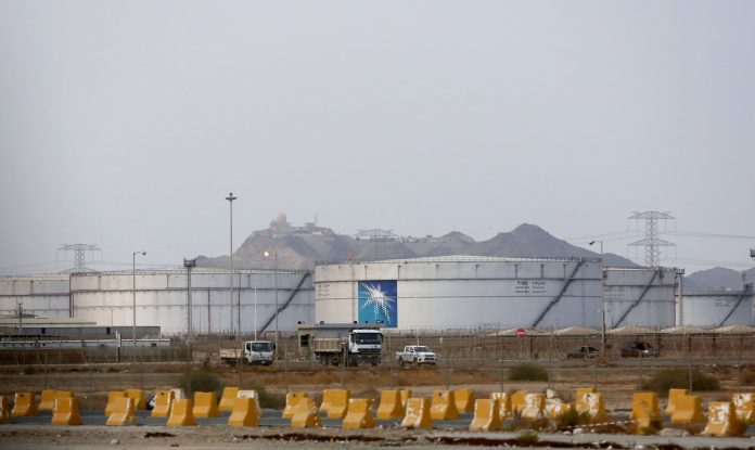 Storage tanks are seen at the North Jiddah bulk plant, an Aramco oil facility, in Jiddah, Saudi Arabia, Sept. 15, 2019. The weekend drone attack in Buqyaq on one of the world's largest crude oil processing plants that dramatically cut into global oil supplies is the most visible sign yet of how Aramco's stability and security is directly linked to that of its owner the Saudi government and its ruling family. AMR NABIL/ AP