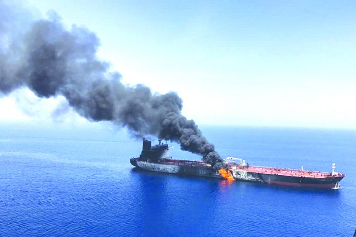 Oil tanker fire In this June 13, 2019 file photo, an oil tanker is on fire in the Gulf of Oman. The U.S. Navy is trying to put together a new coalition of nations to counter what it sees as a renewed maritime threat from Iran. AP