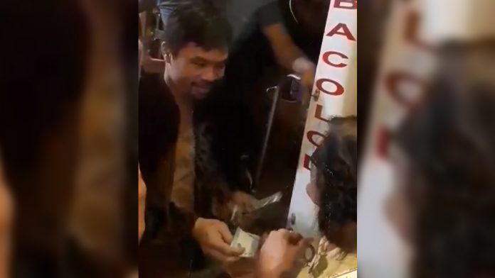 Pacquiao gives away P1 5-M cash during Bacolod visit Sen. Manny Pacquiao shares P1,000 to each residents of Bacolod City on Sept. 20. MAE SINGUAY/PN