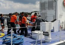 Personnel of the Philippine Coast Guard conduct a rescue operation to members of a paddling team whose boat capsized in a sea mishap in Boracay Island on Sept. 25. PHILIPPINE COAST GUARD