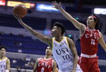 University of Santo Tomas Growling Tigers’ Rhenz Abando evades the defense of University of the East Red Warriors’ Abdul Sawat for a layup. ABS CBN SPORTS PHOTO