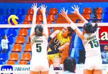 UST, Ateneo stay undefeated in Premier V-League University of Santo Tomas Golden Tigresses’ Imee Hernandez smashes the ball towards two College of St. Benilde Lady Blazers defenders. SPORTS VISION PHOTO
