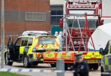 39 killed inside truck near London; driver arrested Police is seen at the area where dead bodies were discovered in a lorry container in Grays, Essex, Britain on Oct. 23. REUTERS/PETER NICHOLLS