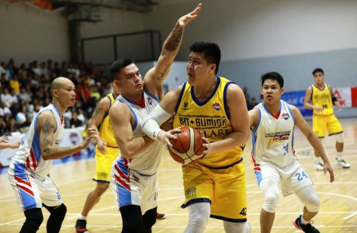 Alfred Batino BRT Sumisip Basilan-St. Clare Saints’ Alfred Batino protects the ball while being defended by Marinerong Pilipino Skippers’ William McAloney. PBA PHOTO