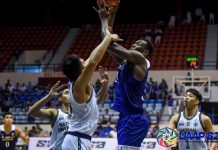 Ateneo Blue Eagles’ Angelo Kouame attempts a hook shot against a National University Bulldogs defender. UAAP PHOTO