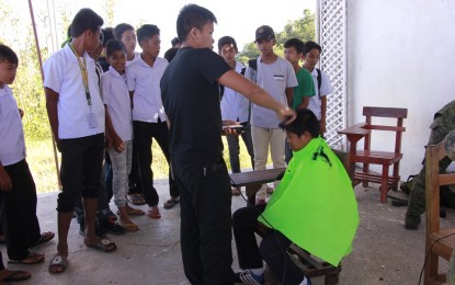 Antique caravan to give free services to ‘conflict’ areas An officer of the Philippine Army gives free haircut to a student in Barangay Tubudan, San Remigio, Antique last year. The Provincial Task Force to End Local Communist Armed Conflict will also conduct a two-day medical and dental mission and information caravan that will benefit around 1,500 individuals from Antique’s two towns starting today. MARGIE GADIAN/PNA