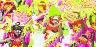 Festival dancers perform during the Santo Niño Ati-Atihan festivity. Around 71 modern and tribal Ati-Atihan groups are set for the opening salvo on Nov. 4. AKLAN FORUM JOURNAL