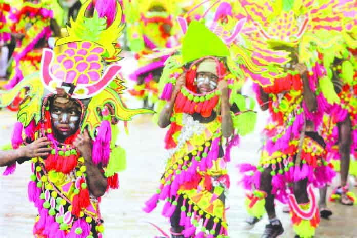 Festival dancers perform during the Santo Niño Ati-Atihan festivity. Around 71 modern and tribal Ati-Atihan groups are set for the opening salvo on Nov. 4. AKLAN FORUM JOURNAL