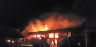 Smoke and flames are seen billowing from the public market of Bago City, Negros Occidental Monday night. Photo courtesy of Jezreel Teo