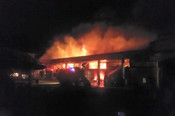 Smoke and flames are seen billowing from the public market of Bago City, Negros Occidental Monday night. Photo courtesy of Jezreel Teo