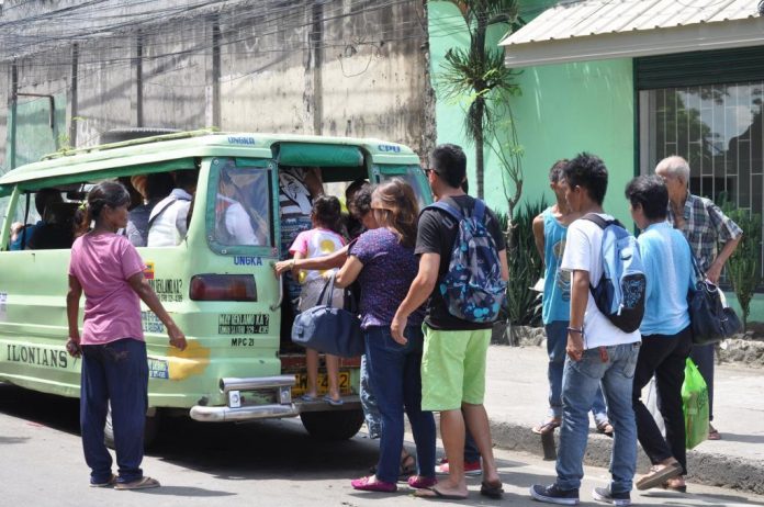 ORDINANCE VIOLATOR. Iloilo City Regulation Ordinance No. 2014-194 makes it unlawful for any person to loiter in public places, open parking spaces and designated loading and unloading areas, and act as barker even with prior consent from the driver or any transport organization. But this woman barker would have none of it. PN PHOTO