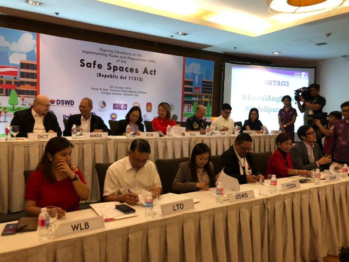 Officials from concerned government agencies and women’s organizations sign the implementing rules and regulations of the Safe Spaces Act or the “Bawal Bastos” law on Oct. 28, 2019. Photo by Daphne Galvez/ INQUIRER.net