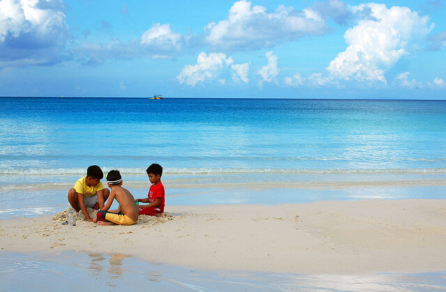 Kids play with the famous white sand in Boracay Island, Malay, Aklan. According to Philippine Chamber of Commerce and Industry-Boracay president Elena Brugger, Filipino kids in the island are now “influenced by the diversity of culture” and the “traditional cultures among them are slowly diminishing.” PHOTO FROM KEN WILSON LEE VIA FLICKR/CREATIVE COMMONS