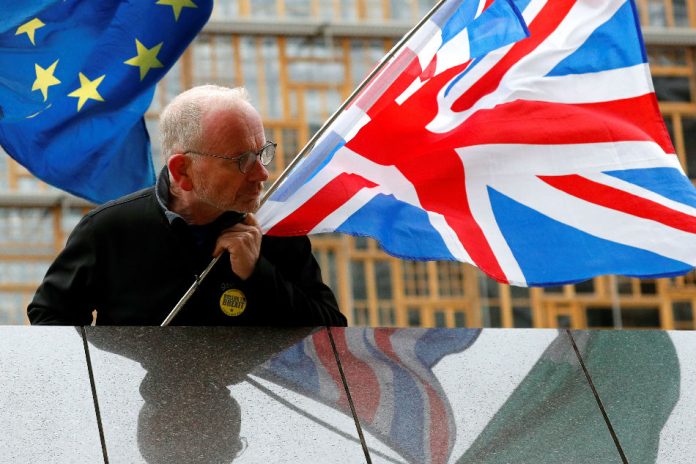 An anti-Brexit protester demonstrates outside the European Union Commission headquarters in Brussels, Belgium Oct. 11. FRANCOIS LENOIR/REUTERS