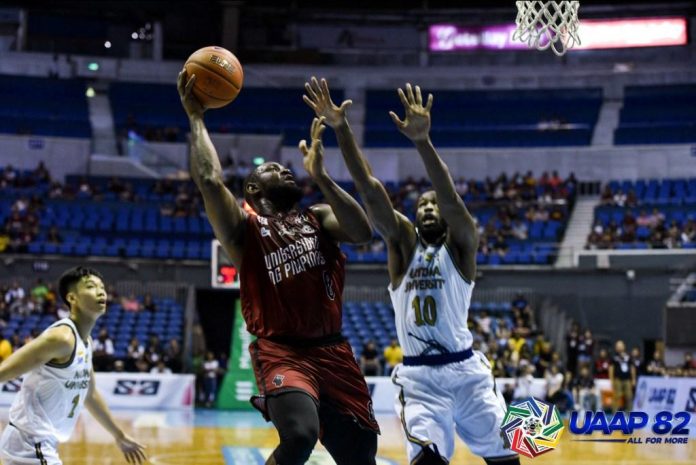 Bright Akhuetie University of the Philippines Fighting Maroons’ Bright Akhuetie attempts a one-hander over Adamson University Falcons’ Lenda Douanga. UAAP PHOTO
