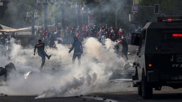 Chile suspends fare hike amid unrest Demonstrators clash with security forces in Santiago, Chile on Saturday. AFP