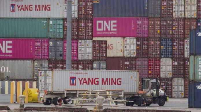 China Shipping containers A truck passes by China Shipping containers at the Port of Los Angeles. MARK RALSTON/AFP