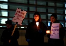 Chinese paper says Britain must ‘accept responsibility’ Anti-racism campaigners take part in a vigil, following the discovery of 39 bodies in a truck container on Wednesday, outside the Home Office in London, Britain on Oct. 24. REUTERS/HANNAH MCKAY