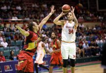 NorthPort Batang Pier’s Christian Standhardinger attempts a jumper against former teammate June Mar Fajardo of San Miguel Beermen. PBA PHOTO