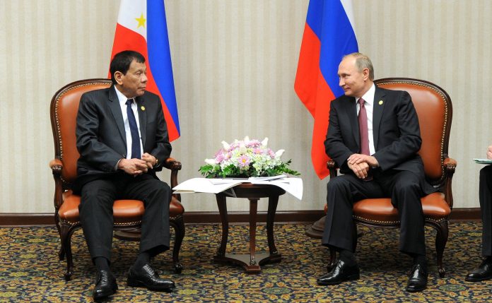Duterte Putin Russian President Vladimir Putin and Philippine President Rodrigo Duterte attend a meeting on the sidelines of the Asia-Pacific Economic Cooperation Summit in Lima, Peru, Nov. 19, 2016. SPUTNIK VIA REUTERS
