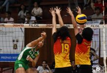 De La Salle University Lady Spikers’ Ernestine Tiamzon scores against a Mapua University Lady Cardinals player. USA PUBLICATIONS PHOTO