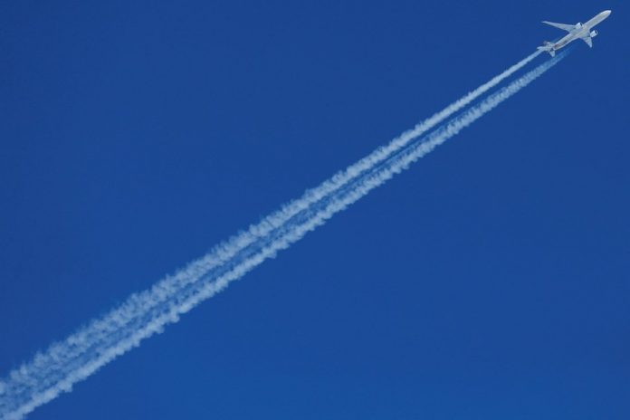 An Etihad Airways Airbus plane flies over St. Moritz, Switzerland, Feb. 13, 2017. Airbus chief executive Guillaume Faury urged the European Union and United States Wednesday to reach a negotiated solution to a long-running dispute over airline subsidies and tariffs, saying there would be no winners in a trade war in the sector. RUBEN SPRICH/REUTERS