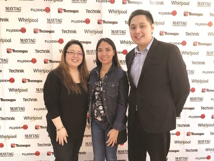 Fujidenzo (From left) Whirlpool Home Appliances marketing manager Joy Catiis-Cruz, Panay News vice president for finance Daneli Salonga and Fujidenzo marketing director Adrian Jasper Sioco.