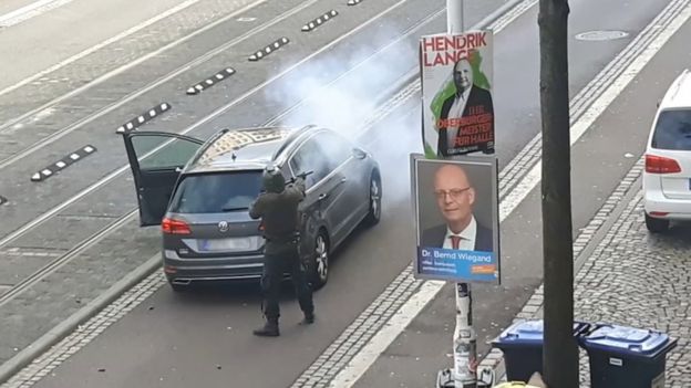 Gunman kills 2 after attacking synagogue The 27-year-old German suspect was filmed wearing a helmet shooting into a local street on Wednesday. REUTERS