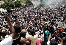 Haitian protesters call for president’s ouster People take pictures with their cellphones as protesters march to demand the resignation of Haitian president Jovenel Moise on the streets of Port-au-Prince, Haiti on Oct. 4. REUTERS/ANDRES MARTINEZ CASARES