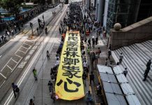 HK braces for ‘fresh’ demonstrations People march with a banner to protest against “the abuse of pro-democracy protesters by police,” near Chater Garden in Central district, Hong Kong, China on Oct. 18. REUTERS/AMMAR AWAD