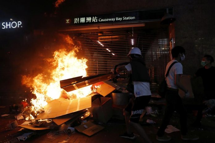 Hong Kong Protest Anti-government protesters set on fire one of the entrances at the metro station at Causeway Bay after leader Carrie Lam announced emergency laws that would include banning face masks at protests in Hong Kong, China on Oct. 4. REUTERS/SUSANA VERA