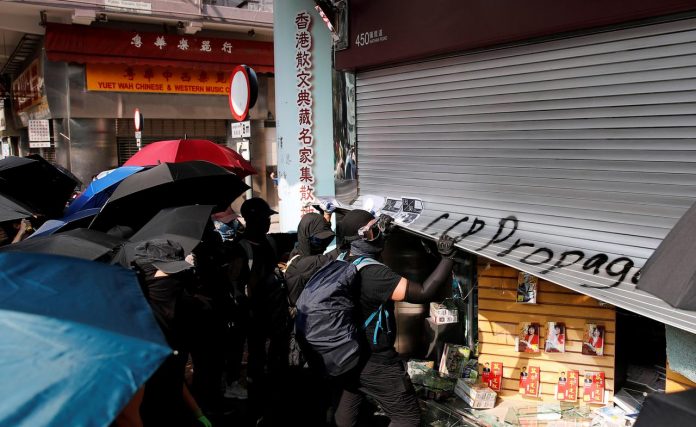 Hong Kong firms lack riot insurance Anti-government demonstrators vandalize a shop during a protest in Hong Kong, China, October 20, 2019. REUTERS
