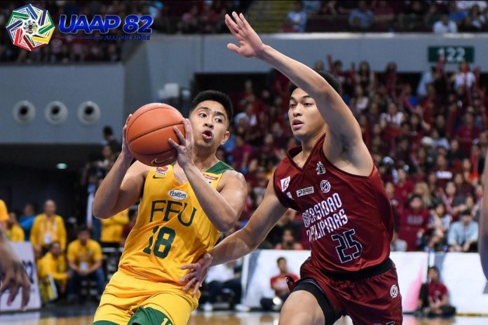 Far Eastern University Tamaraws’ Hubert Cani tries to score against University of the Philippines Fighting Maroons’ Ricci Rivero. UAAP PHOTO