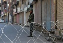 India to lift travel advisory on Kashmir A security force officer stands guard in front of closed shops during restrictions following scrapping of the special constitutional status for Kashmir in Srinagar, India on Sept. 10. REUTERS/DANISH ISMAIL
