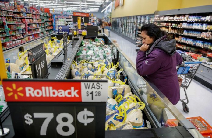 Inflation US A customer shops for a turkey at a Walmart store in Chicago, Illinois, United States, Nov. 20, 2018. KAMIL KRZACZYNSKI/REUTERS