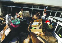 People packs items on a back of a truck, in the aftermath of Typhoon Hagibis , in Yanagawamachi district, Date City, Fukushima prefecture, Japan, Oct. 15. REUTERS