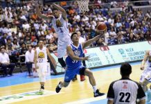 Ilonggo Jericho Cruz of NLEX Road Warriors evades the defense of TNT KaTropa’s KJ McDaniels for a reverse layup. PBA PHOTO