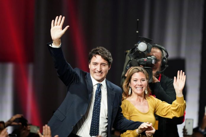 Justin Trudeau Liberal leader and Canadian Prime Minister Justin Trudeau and his wife Sophie Gregoire Trudeau wave to supporters after the federal election at the Palais des Congres in Montreal, Quebec, Canada on Oct. 22. REUTERS/CARLO ALLEGRI