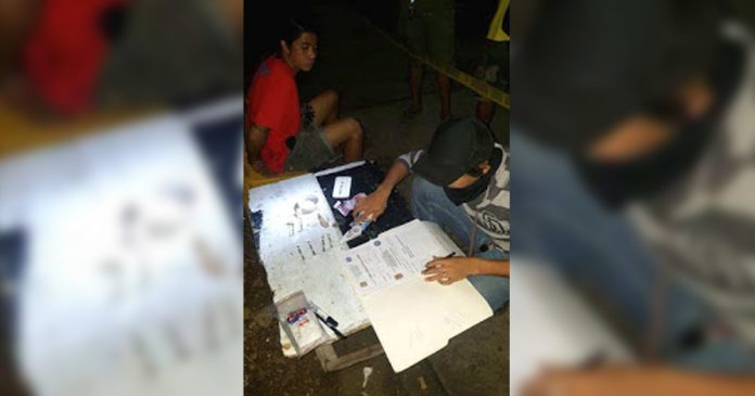 Former drug surrenderer Kim Cahilo (left) was arrested in an entrapment operation in Barangay Manoc-Manoc, Boracay Island, Malay, Aklan on Oct. 21. PDEA 6 PHOTO