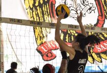 College of St. Benilde Lady Blazers’ Michelle Gamit with a two-handed block. USA PUBLICATIONS PHOTO